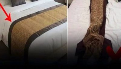 What’s the Purpose of the Fabric Strip Across Hotel Beds?