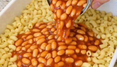 Pour canned baked beans and these 3 ingredients over uncooked elbow macaroni into a baking dish for a hearty dinner your family will crave over and over